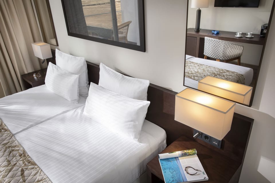 Hypo-allergenic bedding available, in-room safe, desk, laptop workspace