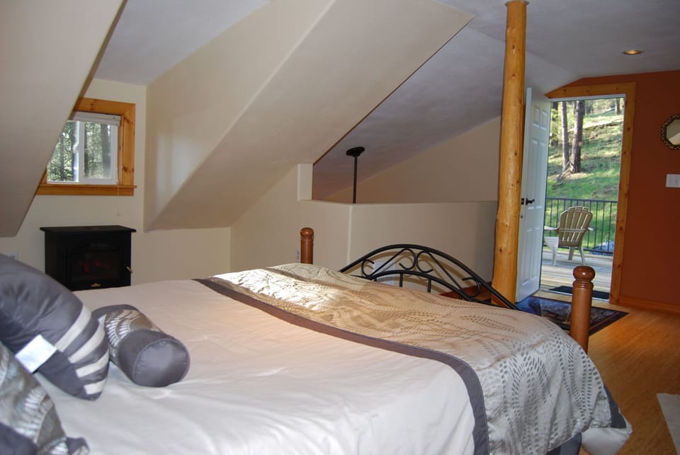 Loft Bedroom with Door to Large Balcony