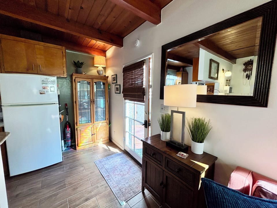 View in Livingroom to front door just steps away to the Pacific Ocean. 