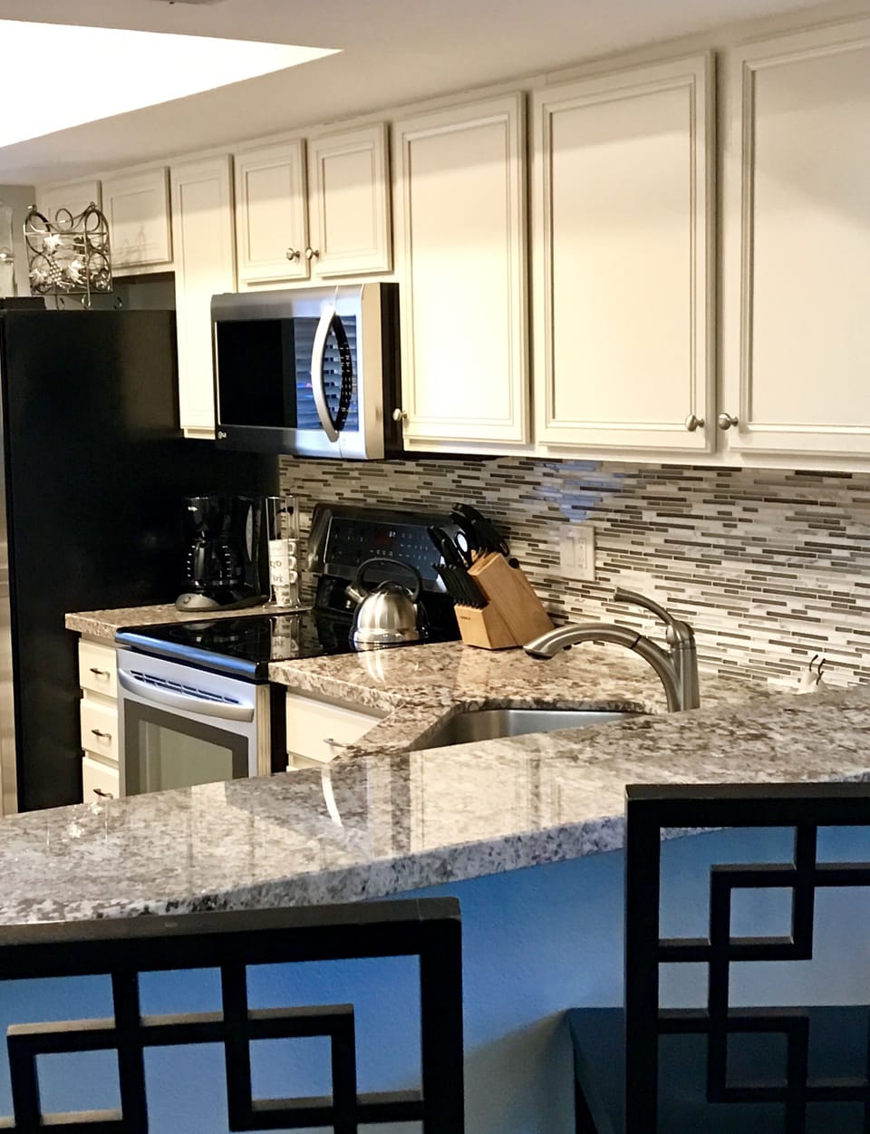 Breakfast counter great for watching the chef, even a glass of wine with friends