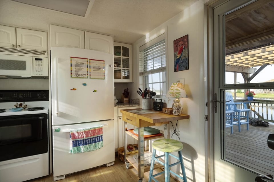 An afternoon sunset glows thru the kitchen windows