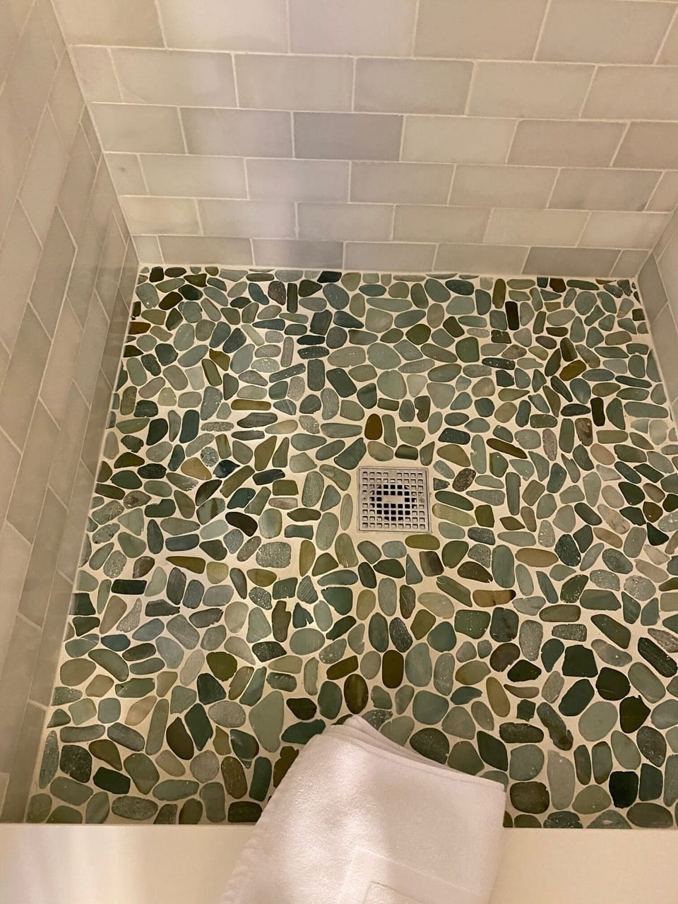 Pebbled shower floor adds a spa like feel to the second bath.
