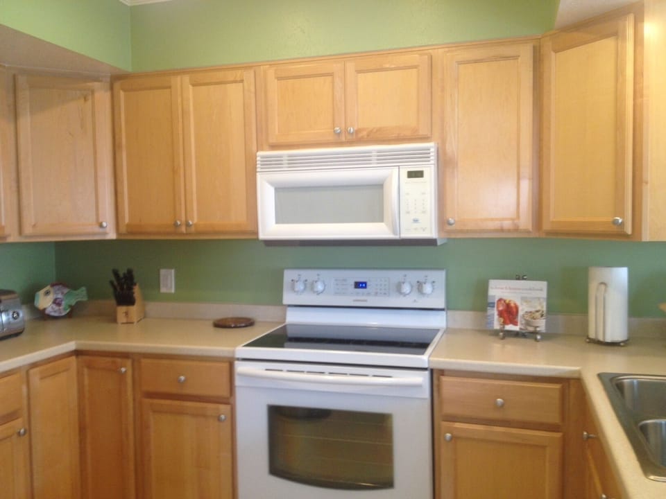 Kitchen with new appliances, dishes, glassware and utensils!  