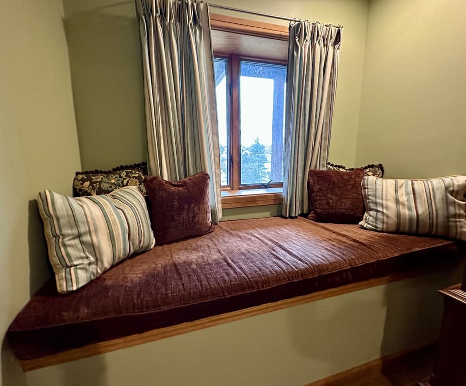 Large cushioned window seat.