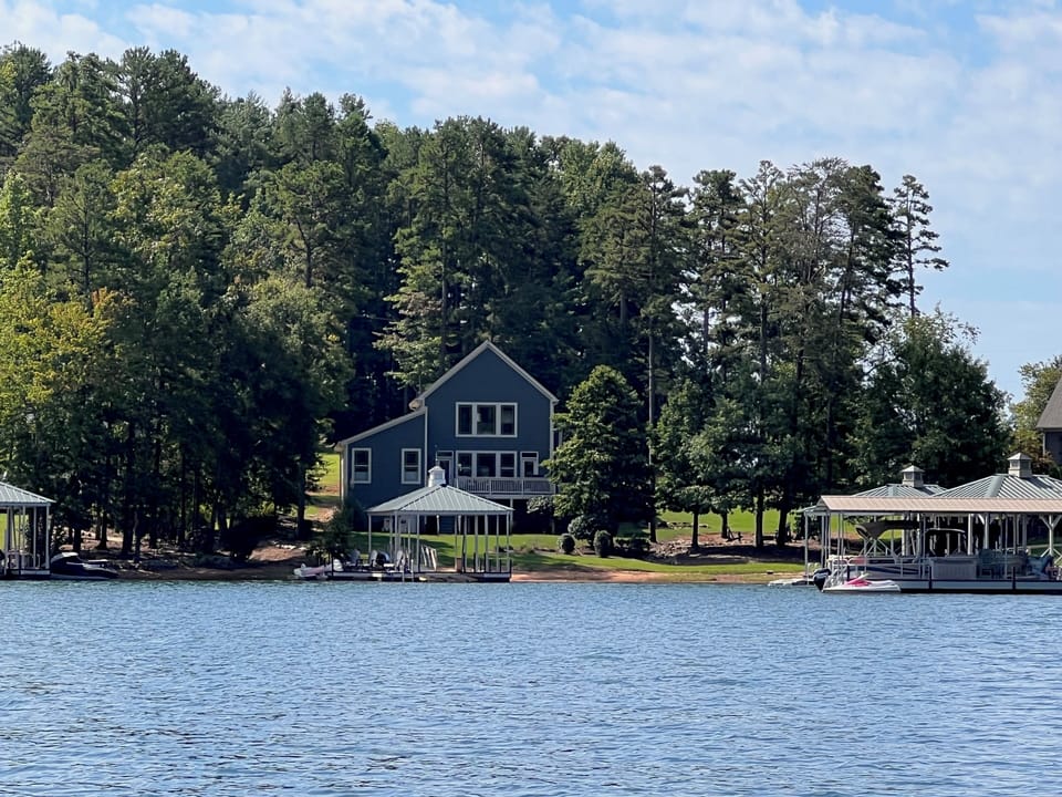 Large lake front with highly sought after flat grassy yard to dock