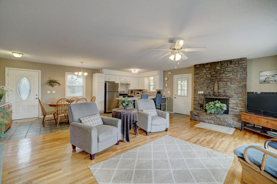 Open floor plan with kitchen, dining, and living room with beautiful lake views