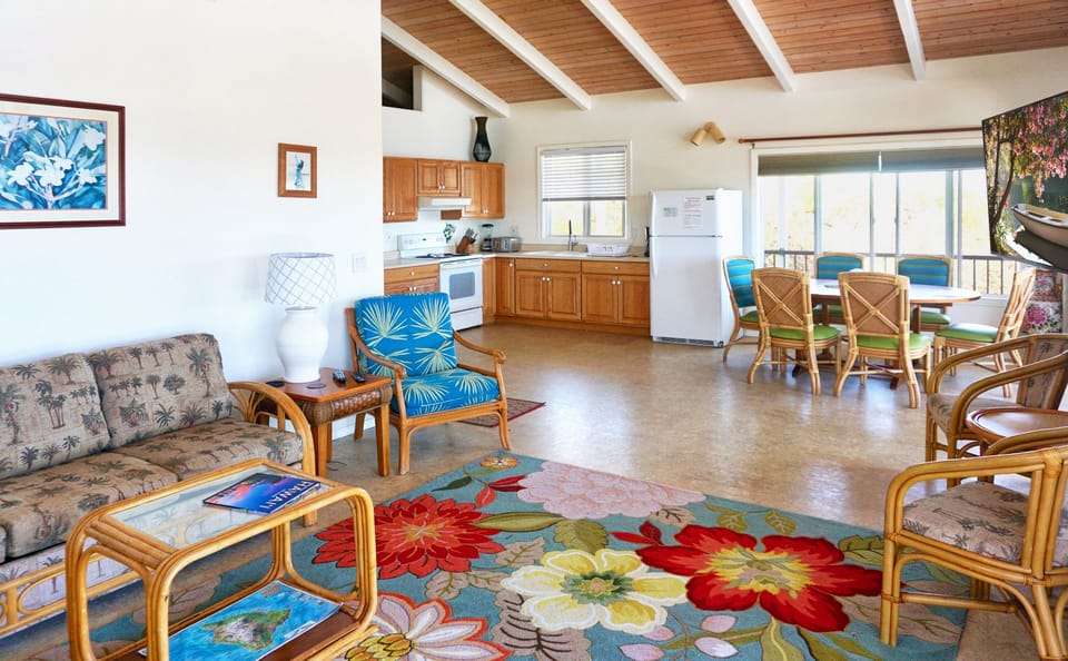 Open floor plan shows living room, dining room and kitchen.