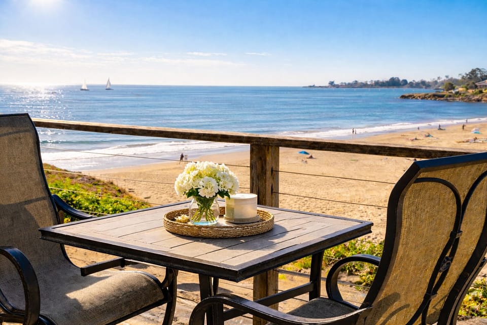 Deck dining over sand with panoramic ocean views