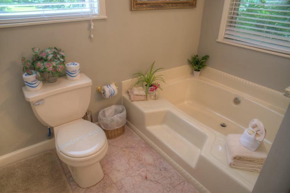 Over sized soaking tub and separate shower in the master bath.