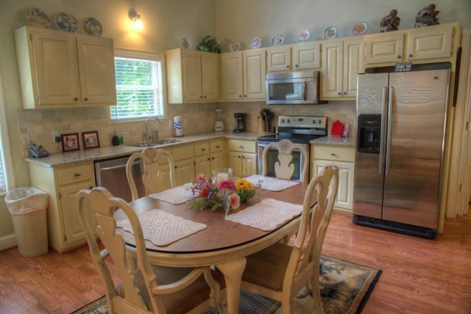 Fully equipped kitchen with stainless steel appliances and granite counter tops.