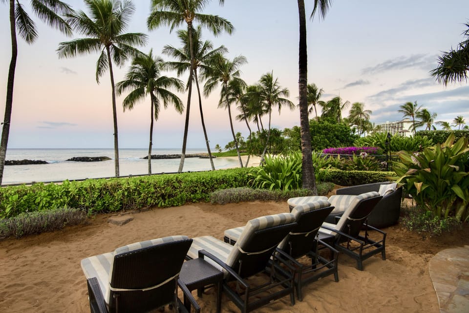 Enjoy watching beautiful sunsets at the sandy lounge by the pool bar.