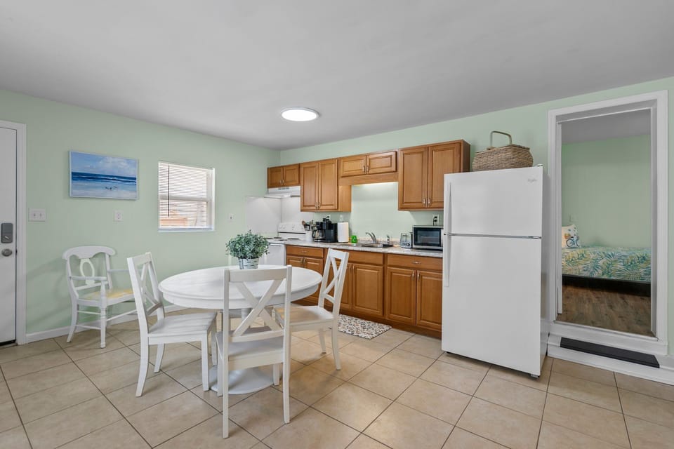 Your bright kitchen features everything you need for beach getaways, from morning coffee to casual meals with loved ones.
