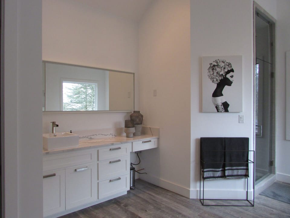 Roomy Master Bath with his and hers vanities and enormous shower and tub.