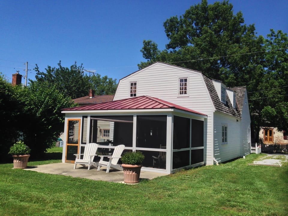 Rear of house with Screened Porch and Patio great for barbecuing!