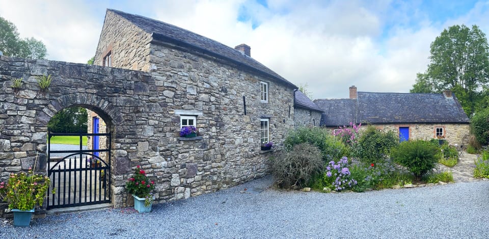 Courtyard, showing gate to Guest Cottage. The Main Cottage is in the background.