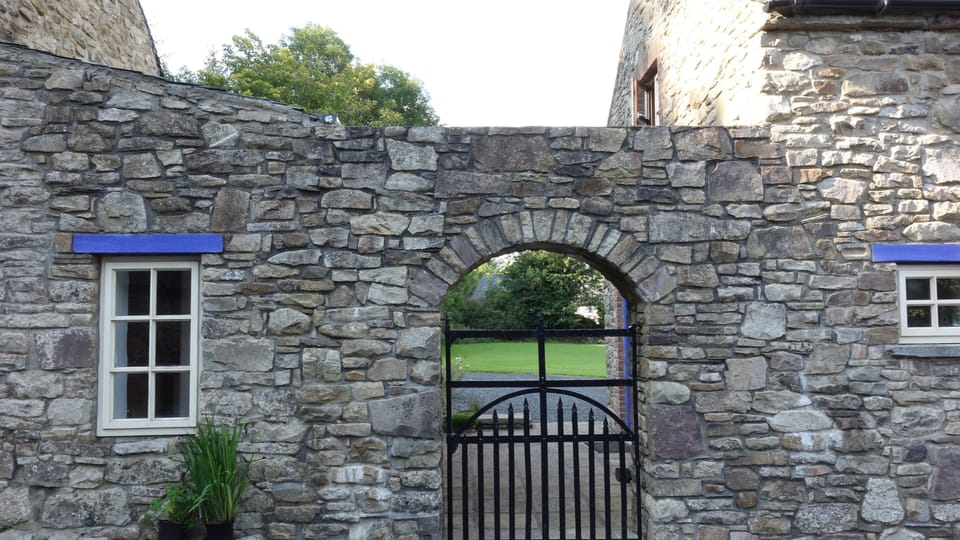 Archway leading from courtyard to Guest Cottage