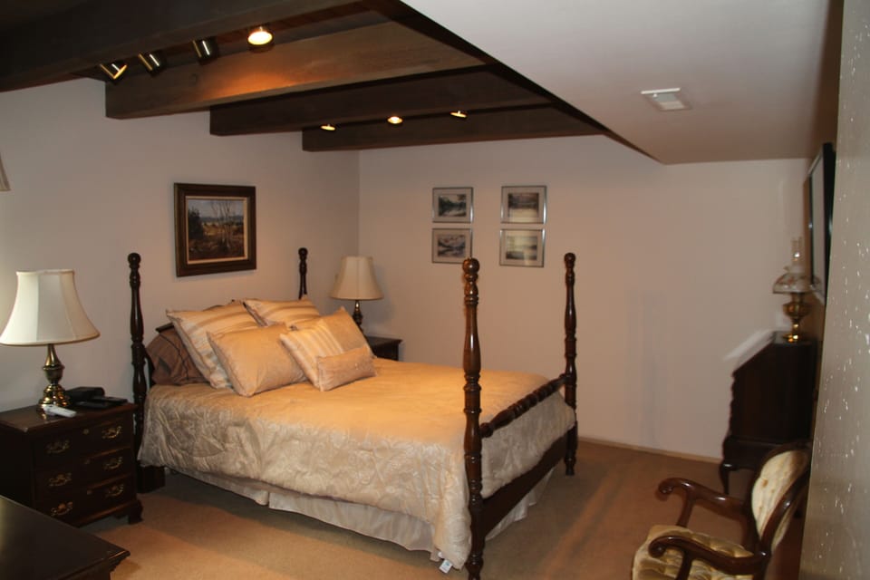 Master bedroom with queen bed.  Master bath has a Jacuzzi tub and marble shower.