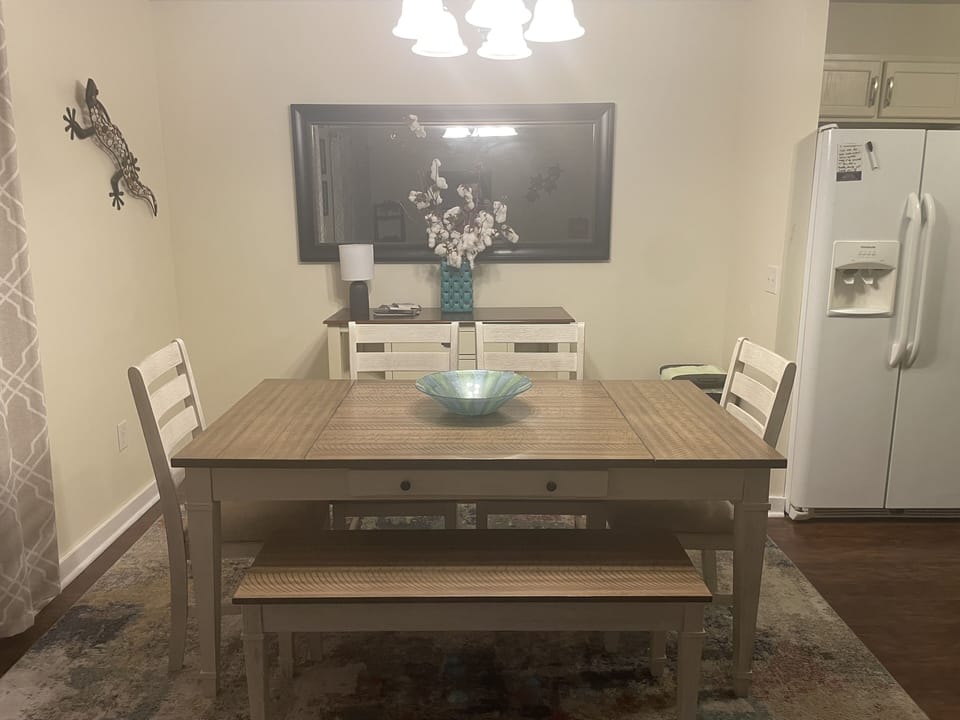 New dining room table with 4 comfortable chairs and a convenient bench.