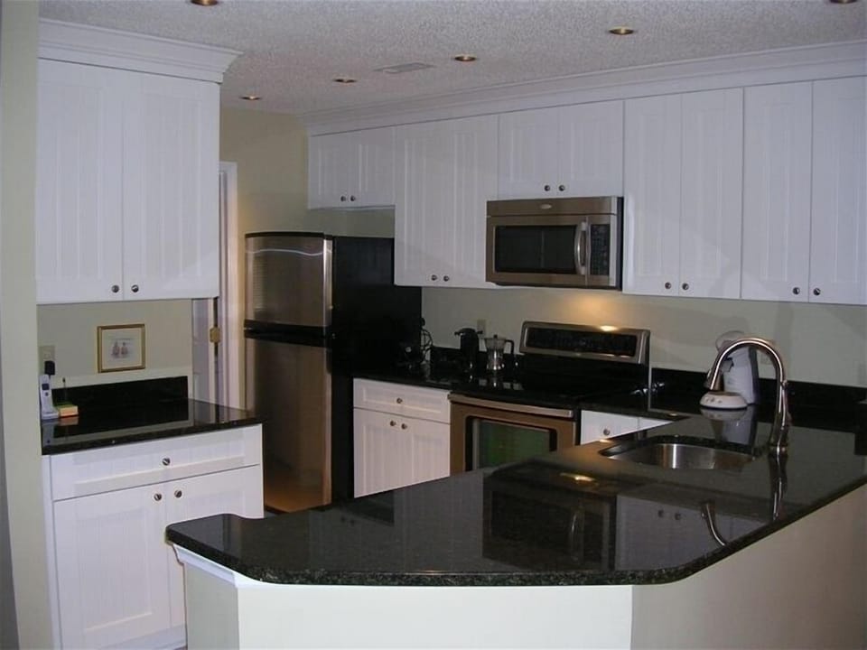 Newly remodeled kitchen with granite counter tops and new stainless appliances