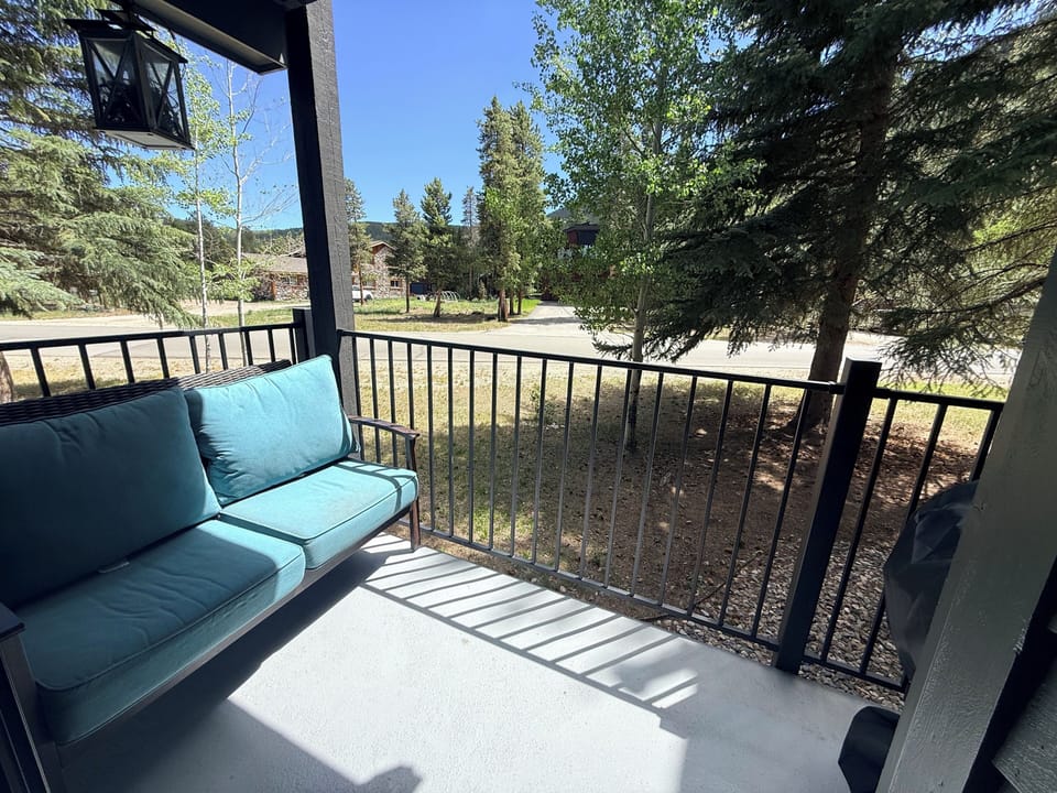 Love seat and electric grill (gas isn't allowed) on your private porch.