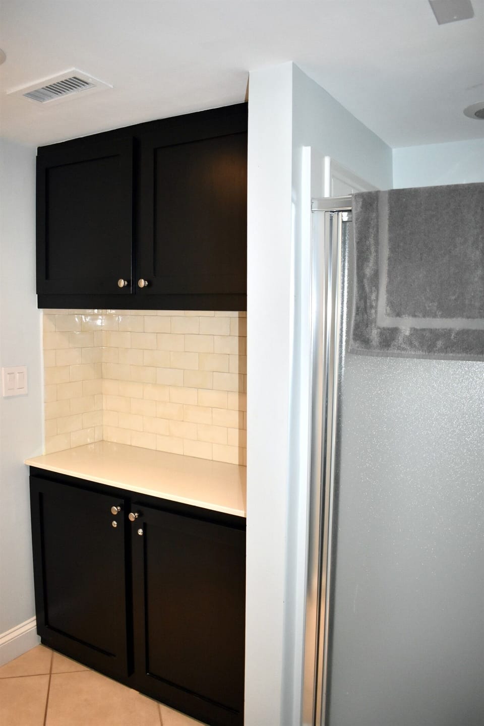 Guest Bath with Shower and Laundry Folding Table