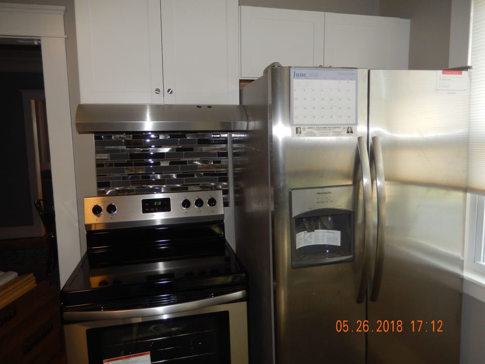 New Stainless steel appliances include Stove, refrigerator and dishwasher.