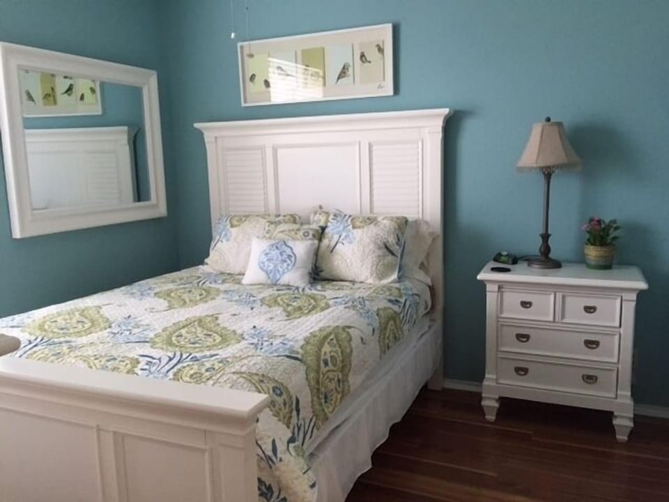 Queen bed and night stand.
