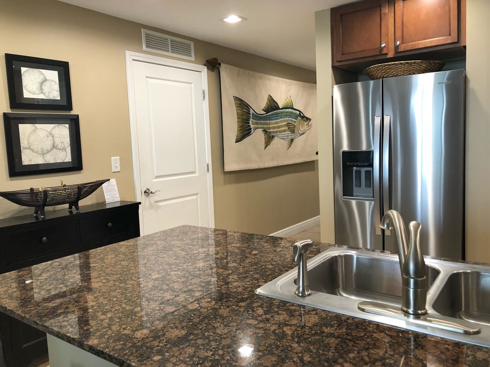 Large hallway with washer and dryer in closet.