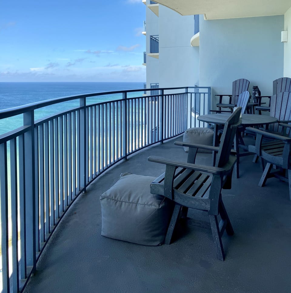 Huge balcony with seating for 6 and 2 poufs. Great place to enjoy a sunset meal!