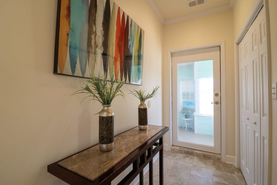 Hallway leading to the back patio with a hot tub