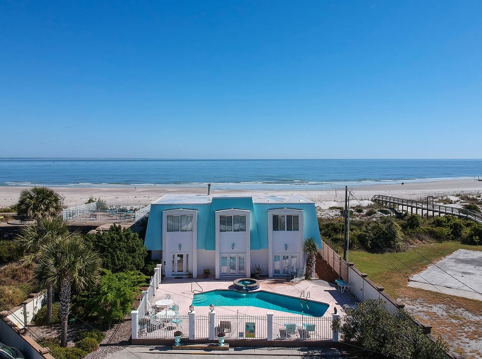 Outside view of the home and pool