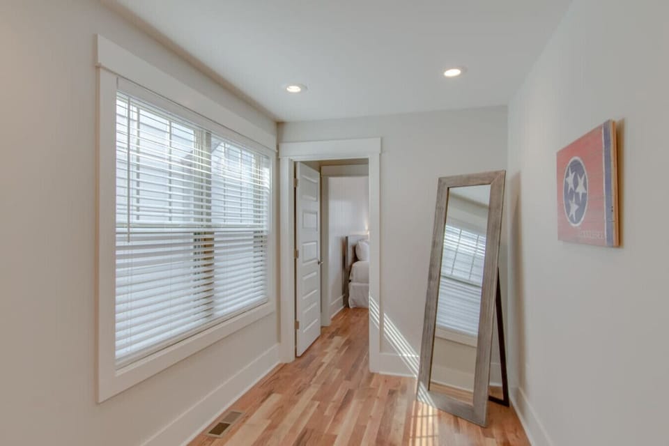 A full-length mirror creates a stylish and practical finishing touch in the bedroom.