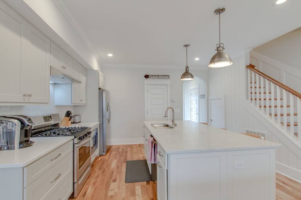 A bright and airy kitchen with plenty of counter space and all the essentials for group cooking.