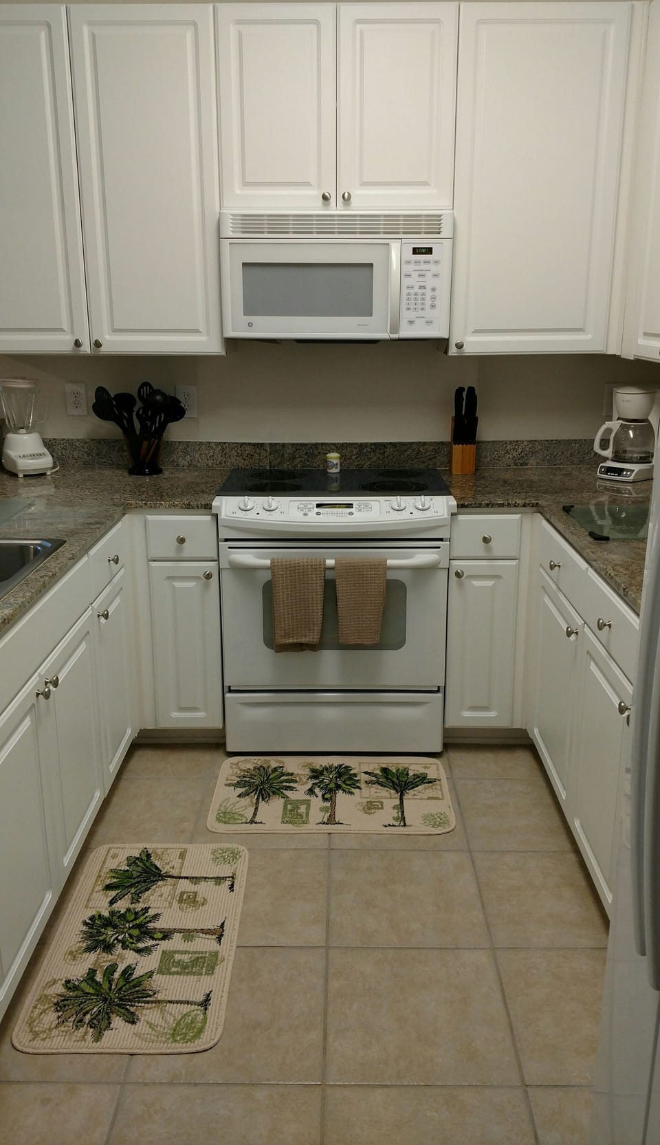 full kitchen  with dishes and all cooking utensils 