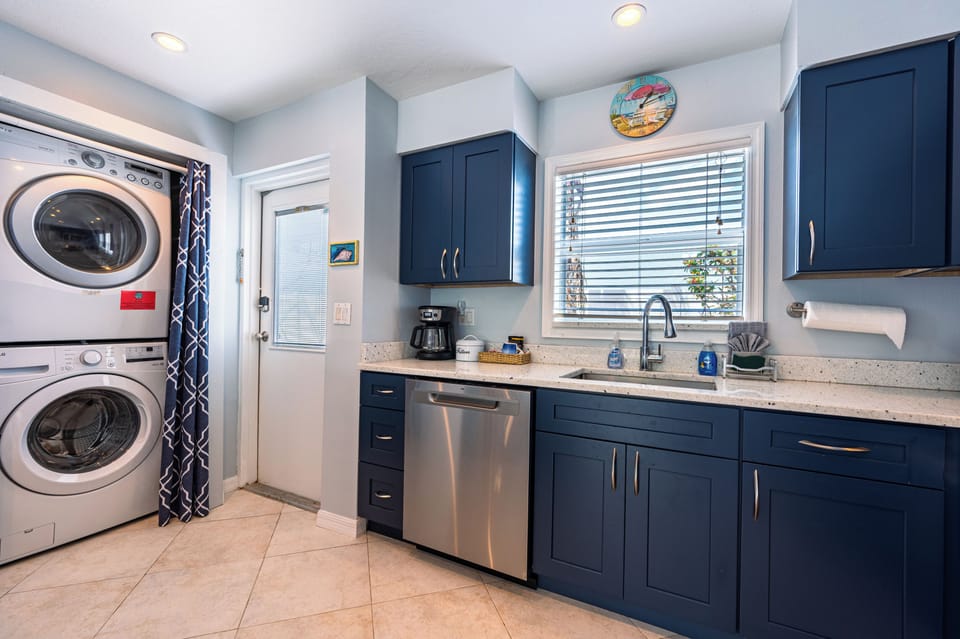 Kitchen with front load washer / dryer