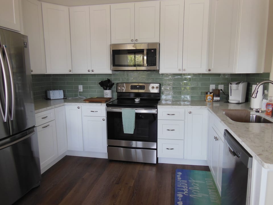 Kitchen is stocked with all new dishes, cookware, utensils and appliances
