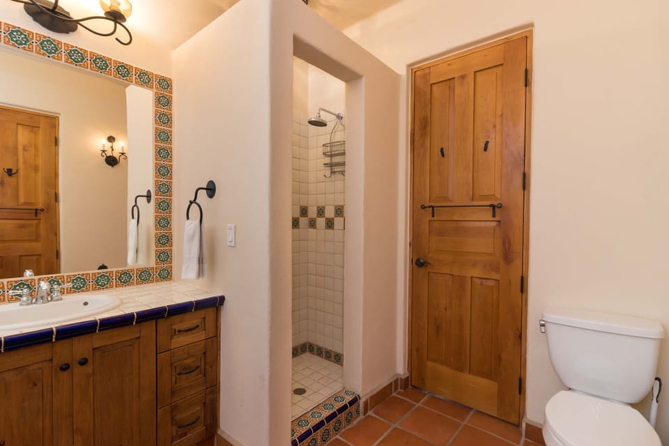 Rain shower heads in all bathrooms offer a spa-like experience.