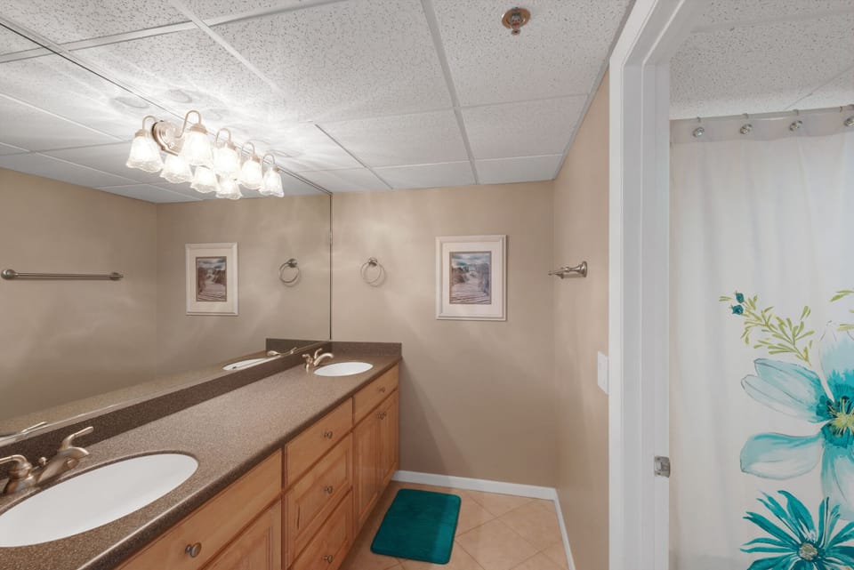 Guest bath with dual sinks, garden tub/shower combination.