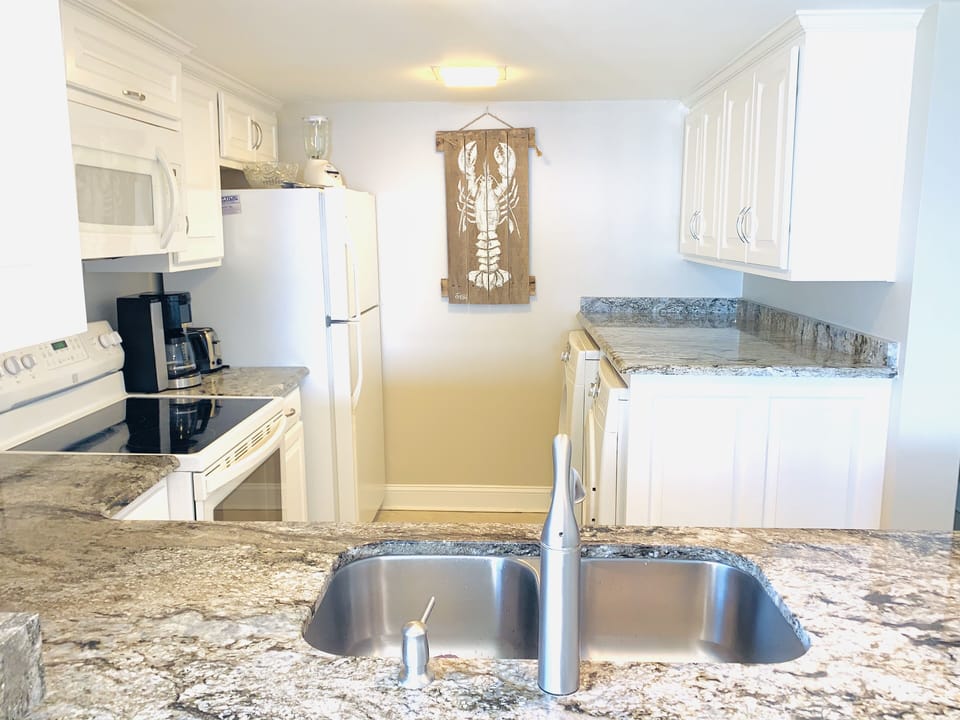 Kitchen-Has everything to prepare family meals while enjoying the ocean views