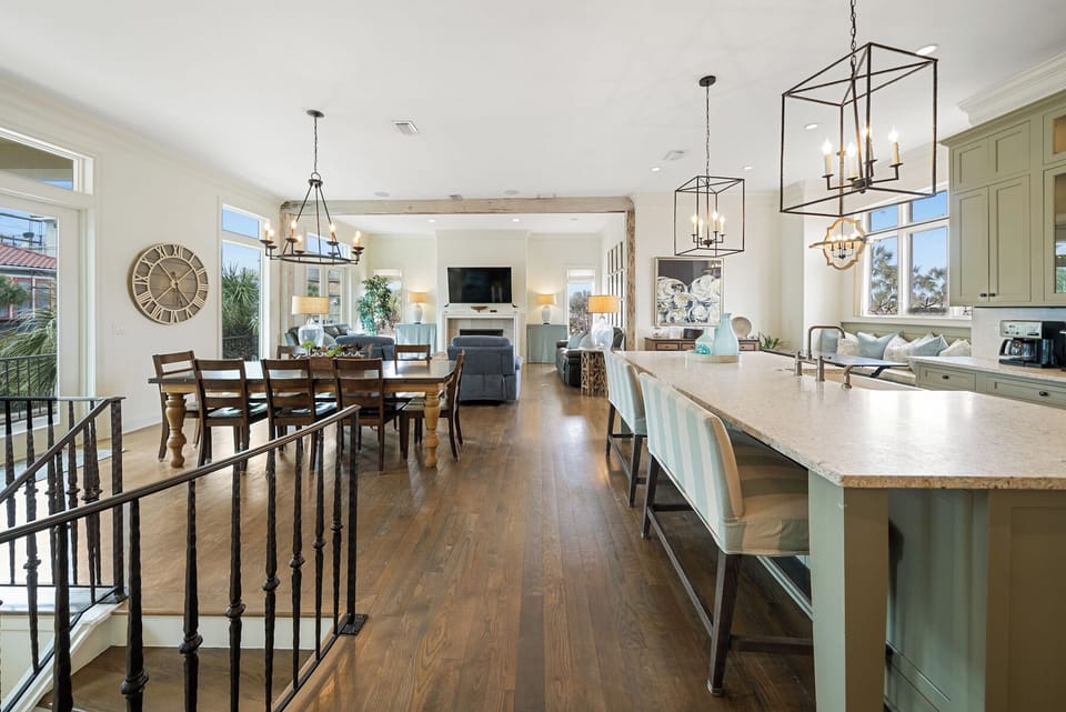 Step into your open-concept sanctuary where the kitchen island becomes your morning coffee spot and evening gathering place.