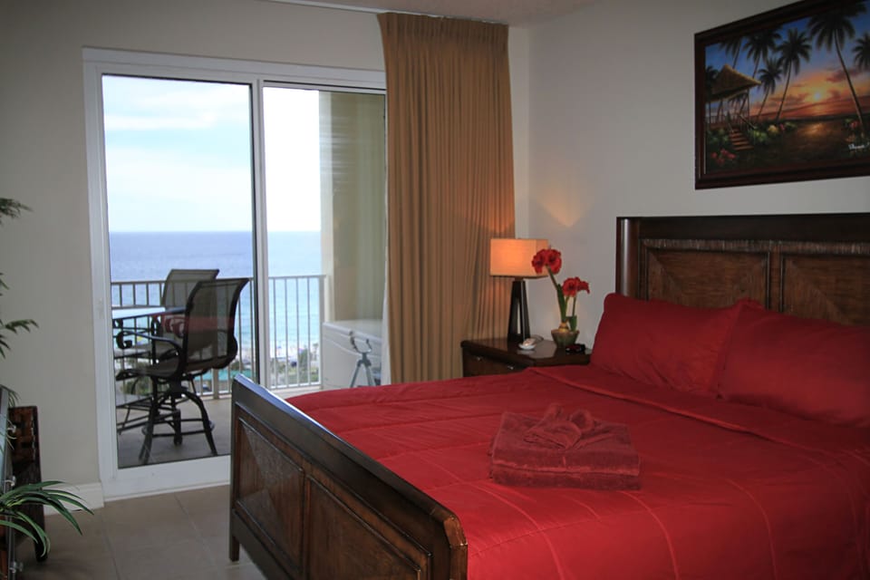 Master Bedroom - Balcony Access, King Bed, Huge Bathroom! Large TV.