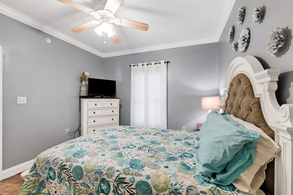 Bedroom 2 features queen-sized bed, TV, dresser, nightstand, and closet. This bedroom also has a door leading to a full-sized bathroom.