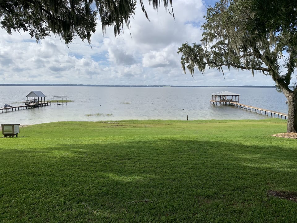 105 feet on Lake Weir. Tie your vessel up to bottom anchors right in back yard!
