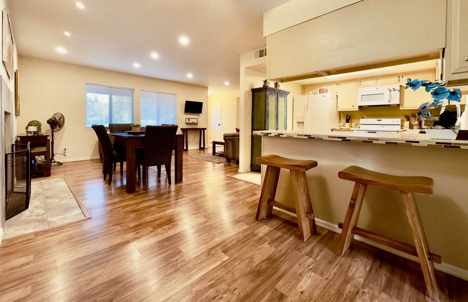 Breakfast nook w/ 2 bar height chairs.