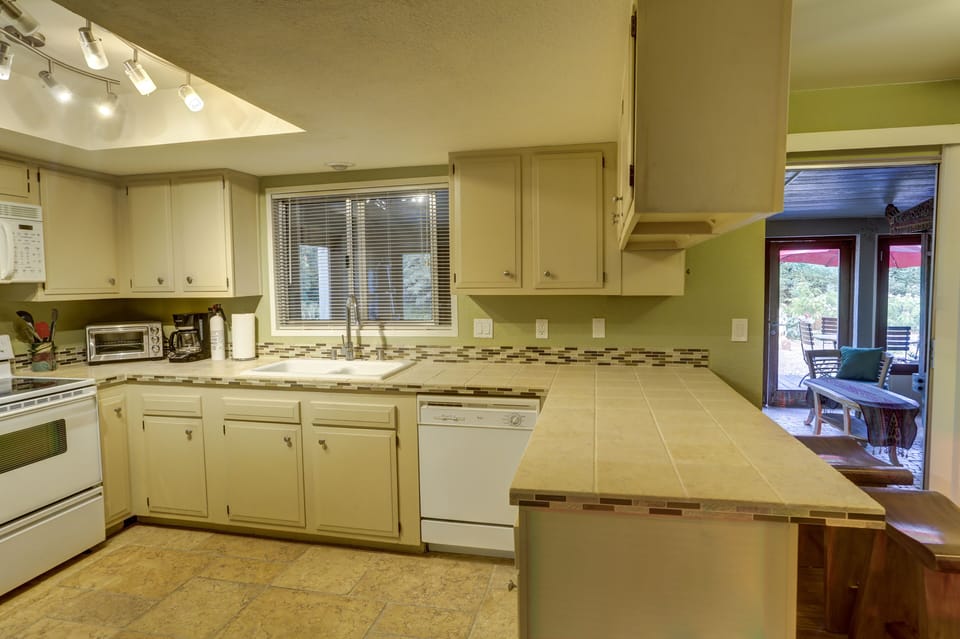 Kitchen, fully equipped w/ glasses, plates, bowls, pots and pans, blender.