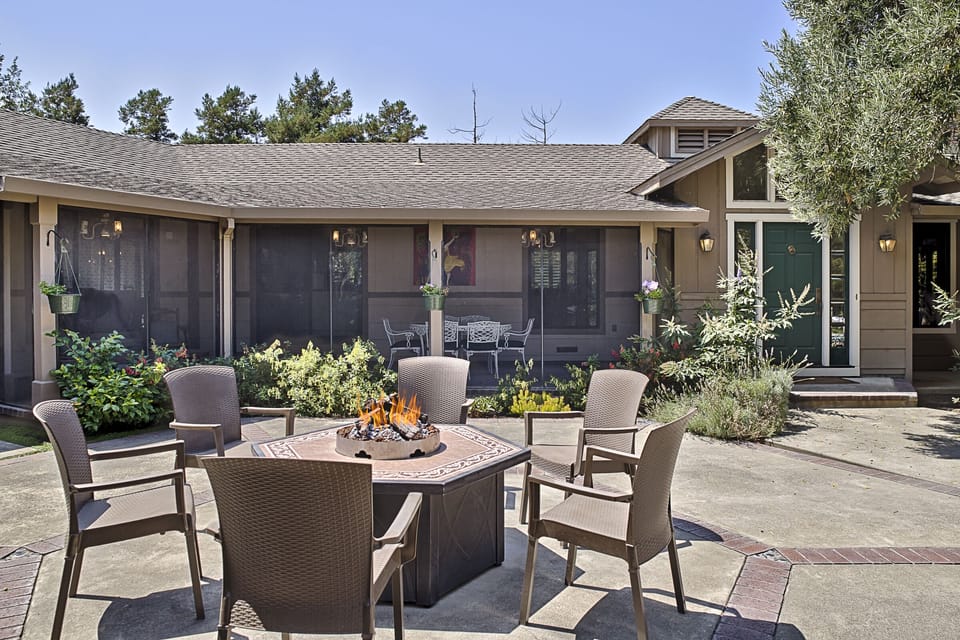 Fire pit, bbq patio, background: enclosed outdoor dining porch