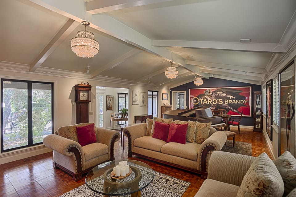 Great room: formal dining area,  grand piano, fireplace, tv