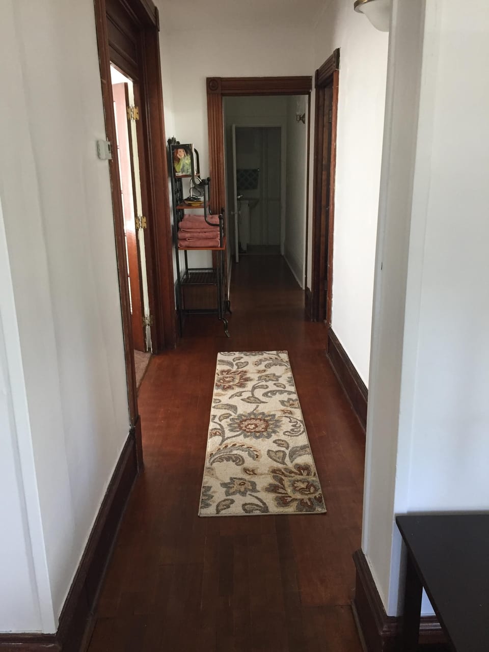 hallway to bedrooms, kitchen & bathroom