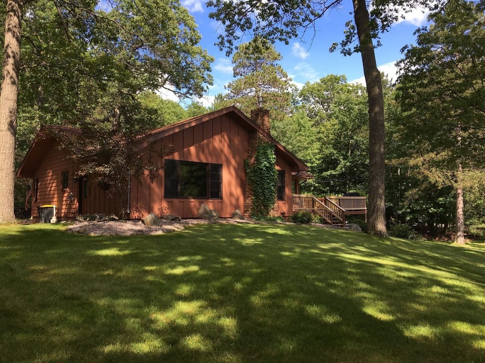 Large Oak trees give character to this Sand Lake property.