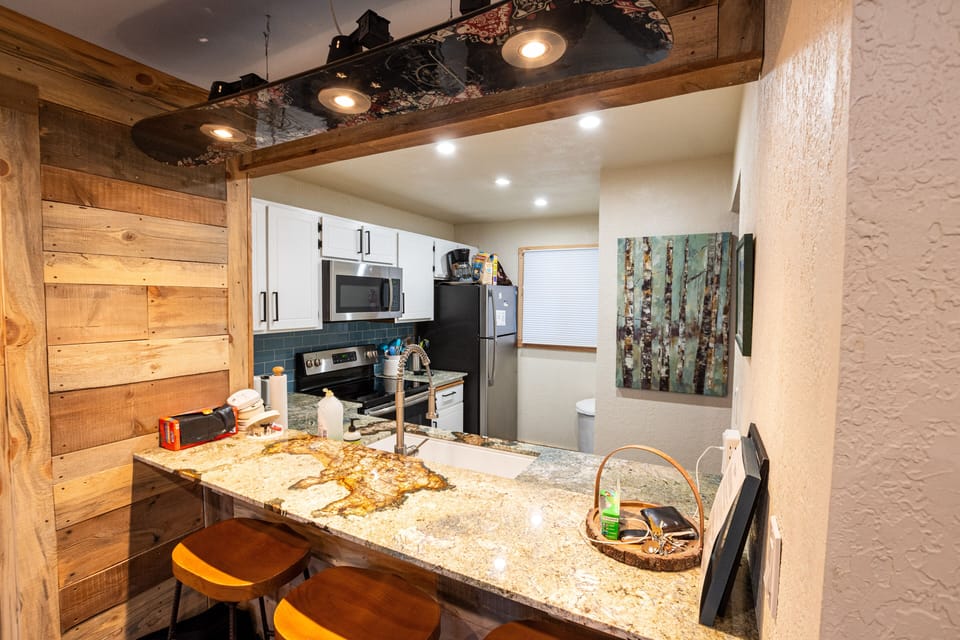 Kitchen with stainless steel appliances.  